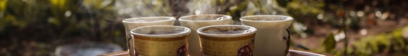 five steaming cups of tea