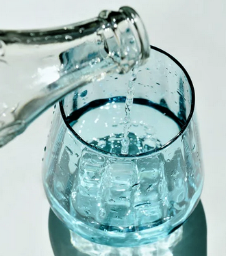 clean water being poured into a cup